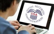 Man working on computer showing Social Security Administration screen