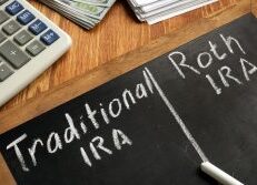 Photo of chalkboard doing pros/cons of Traditional IRA vs. Roth IRA