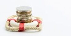 Photo of life ring with money stacked inside